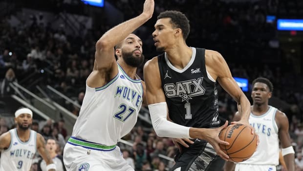 Jan 27, 2024; San Antonio, Texas, USA; San Antonio Spurs forward Victor Wembanyama (1) drives to the basket against the Minnesota Timberwolves center Rudy Gobert (27) during the first half at Frost Bank Center.